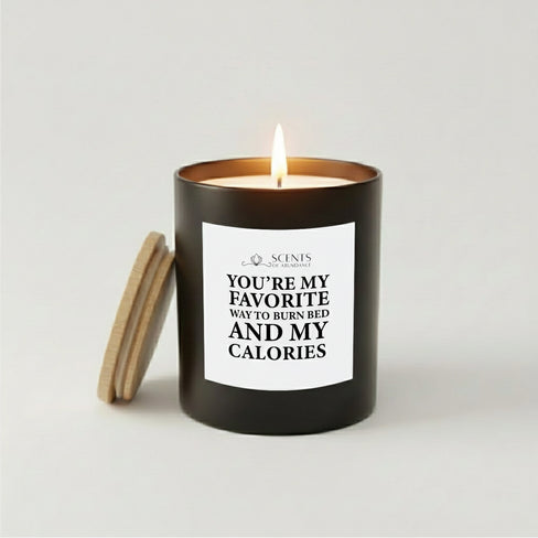 Favorite Way to Burn Calories scented humor quote candle in a black glass jar