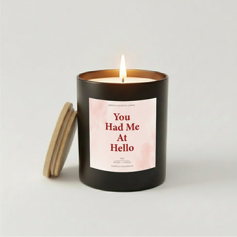You Had Me At Hello candle in black jar with pink watercolor label.